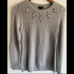 The limited gray rhinestone sweater